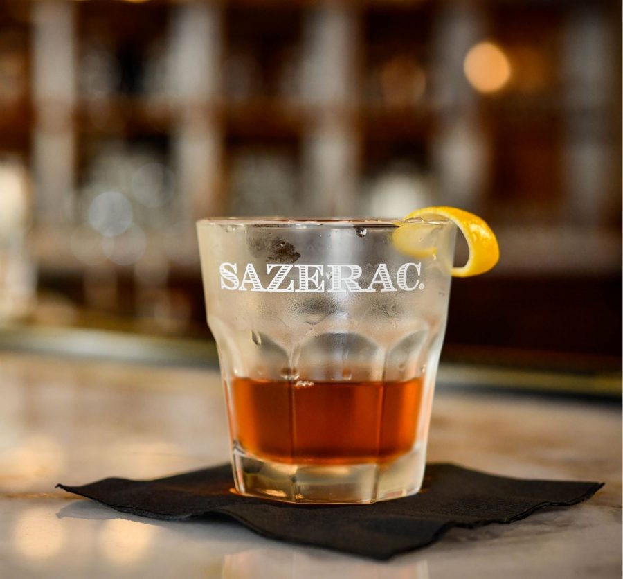 The Sazerac being served on a marble bar top